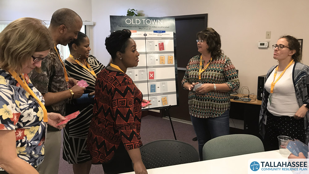 Attendees discuss plans with staff